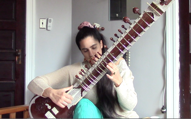 Ami Dang playing sitar