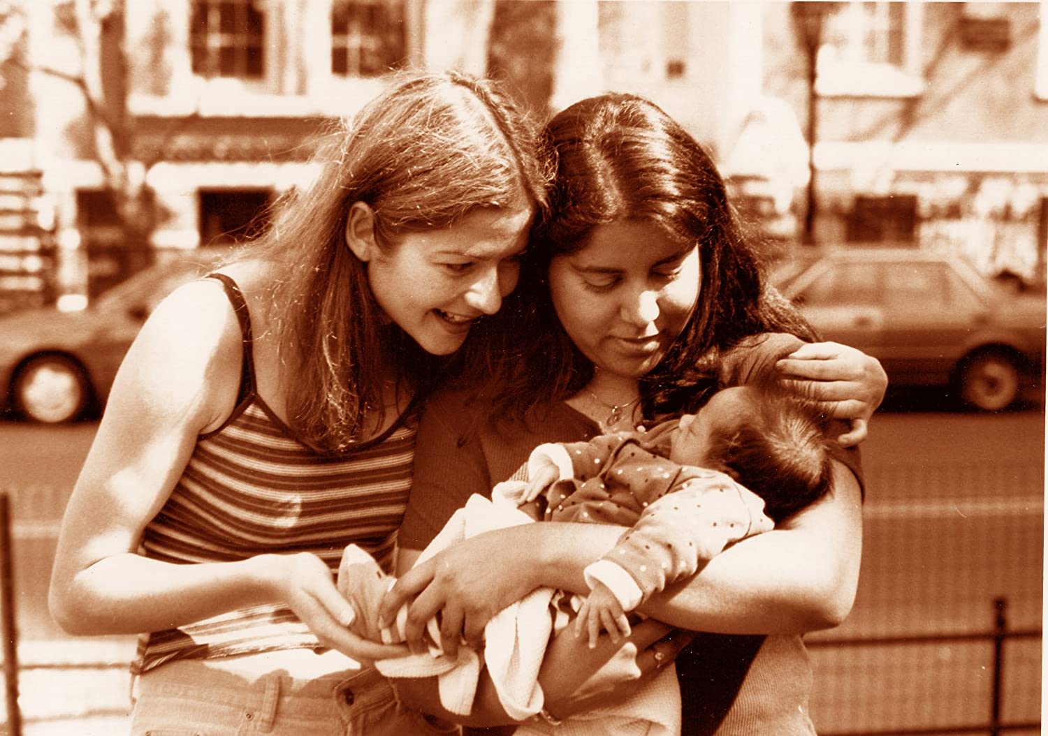 Screenshot of Reena, her girlfriend Lisa, and their baby